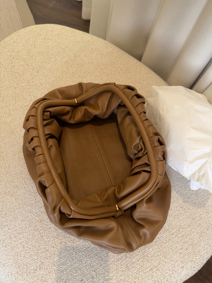 Bottega Veneta The Pouch brown leather open interior view