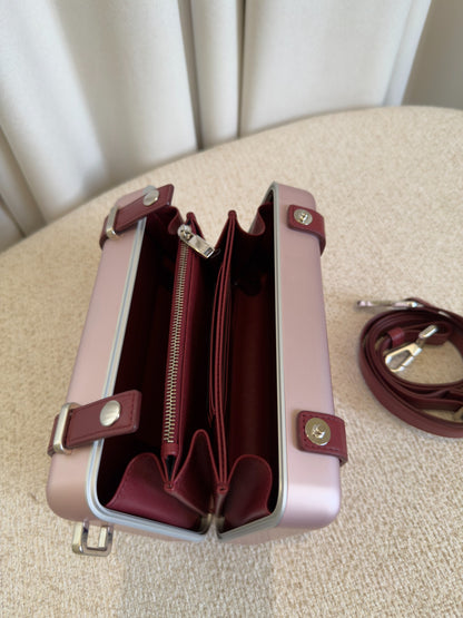 Dior x RIMOWA pink aluminium personal clutch burgundy interior view