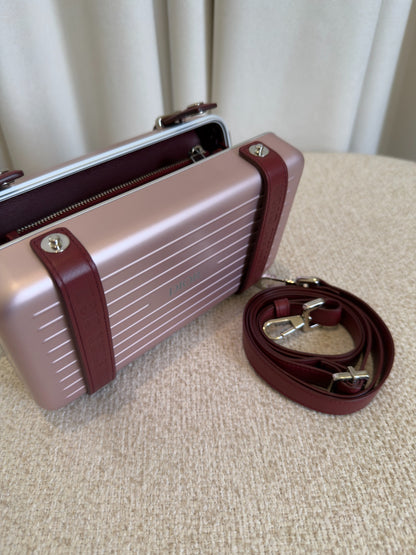 Dior x RIMOWA pink aluminium personal clutch open view with detachable strap