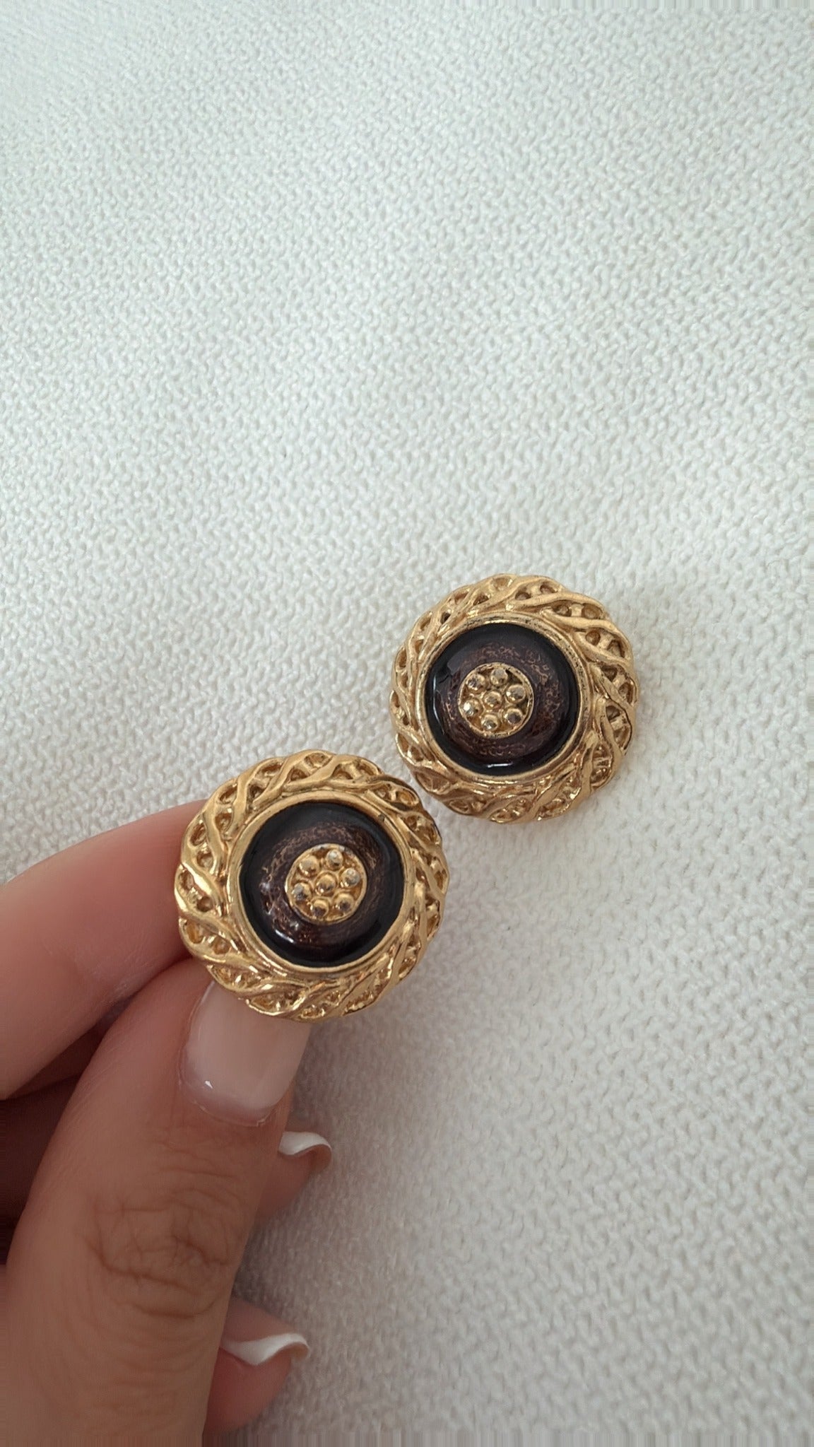 Vintage brown and gold-tone button earrings close-up