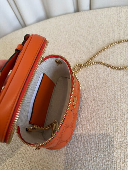 Gucci GG Marmont orange mini vanity case interior and pocket detail