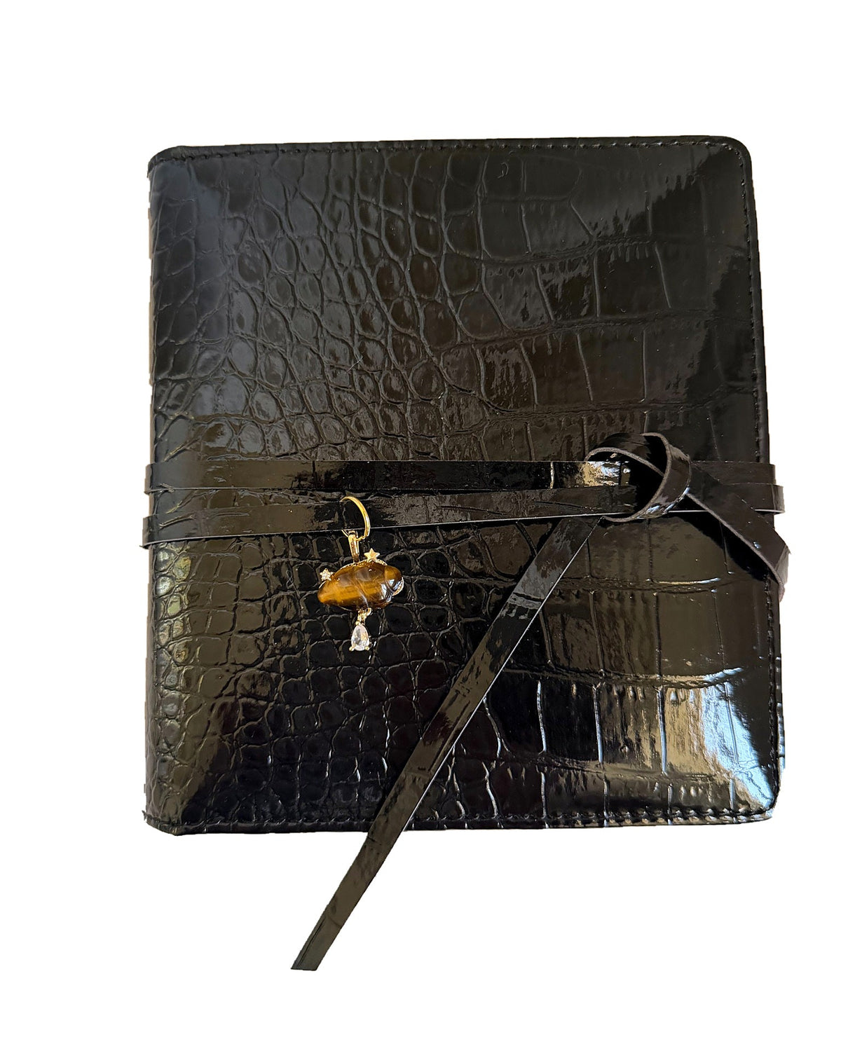 Elali croc journal with brown croissant charm on a clean white background