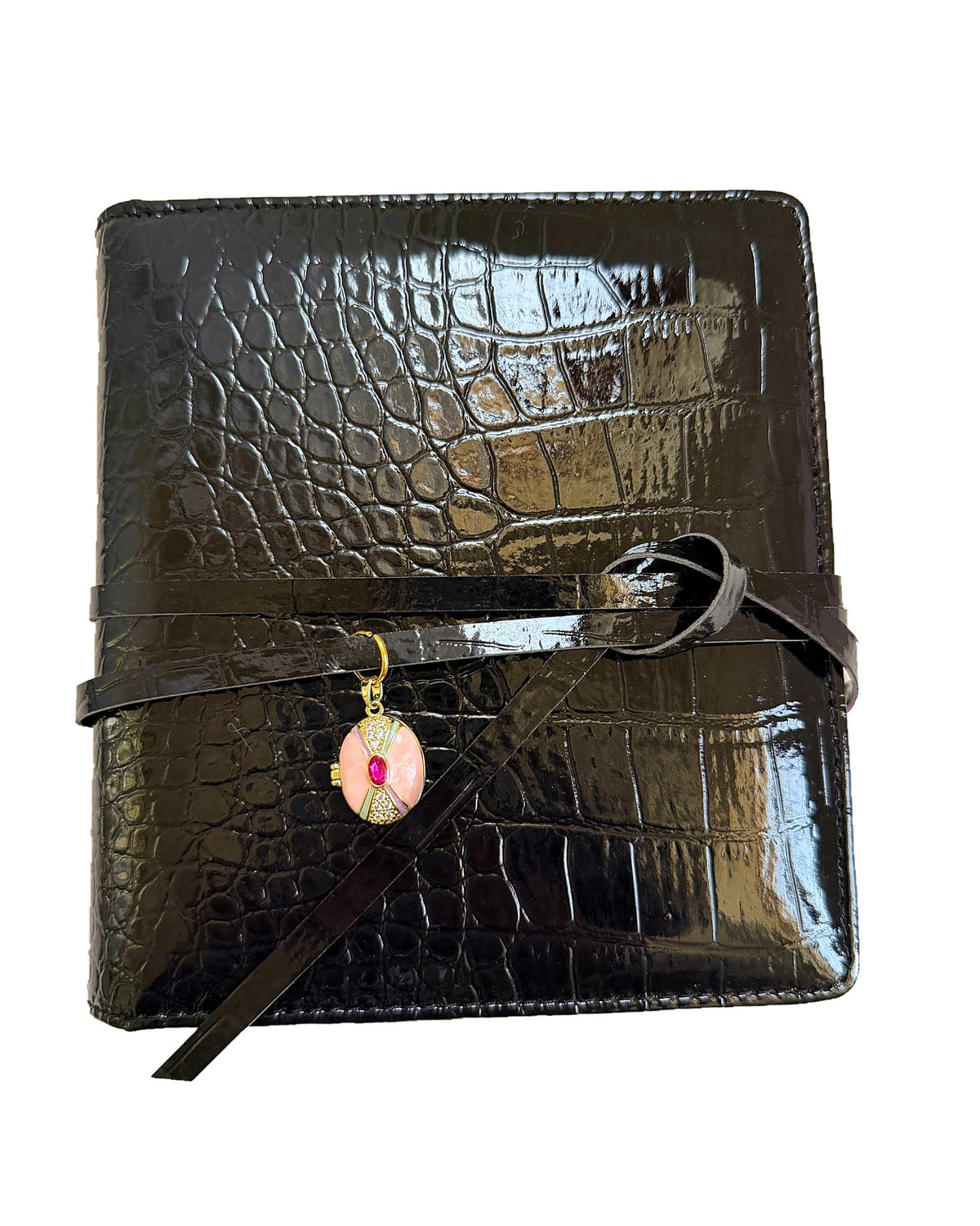 Elali croc journal with pink locket charm on a clean white background
