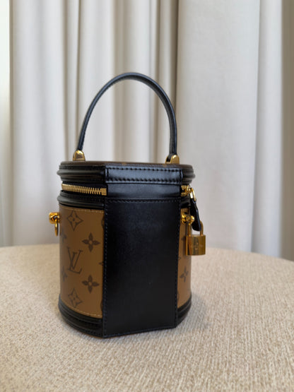 Louis Vuitton Cannes Monogram Reverse vanity bag side view with padlock