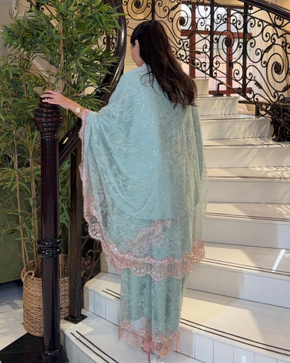 Back view of Mermaid Elan mint lace three-piece set with peach trim