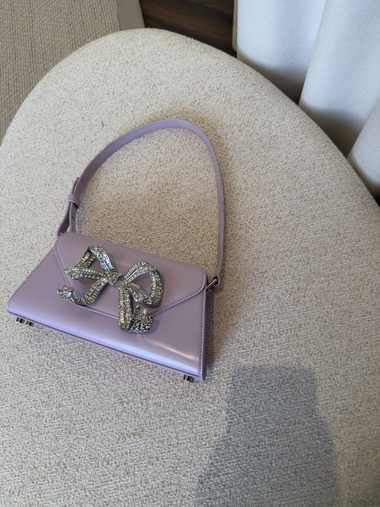 Self-Portrait lilac patent mini shoulder bag front view with crystal bow
